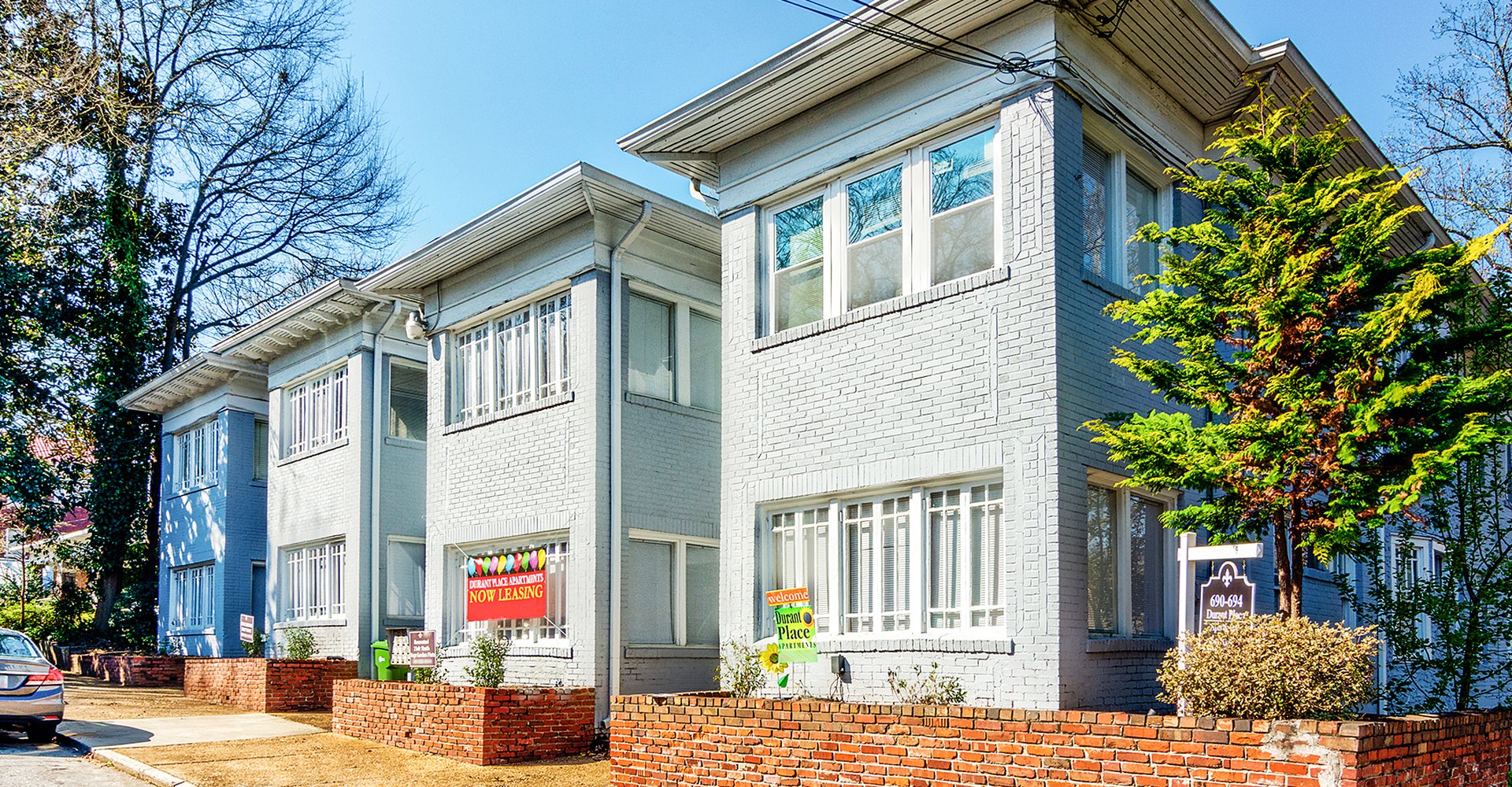 entrance of the Beachfront Buckhead apartments with sign